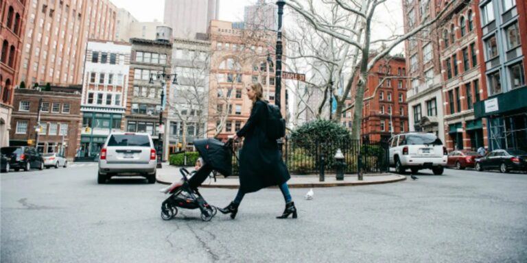 mom walking a baby in a stroller