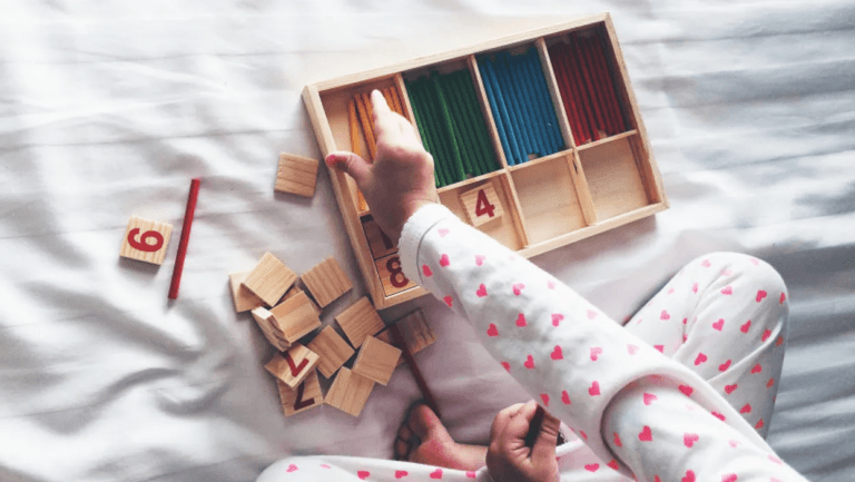 toddler playing with montessori toys