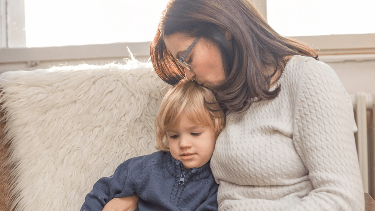 grandma kissing grandson on the head