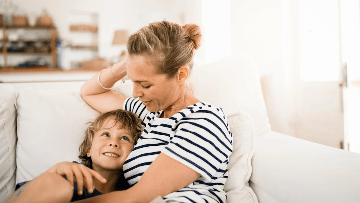 mom and son snuggling on the couch