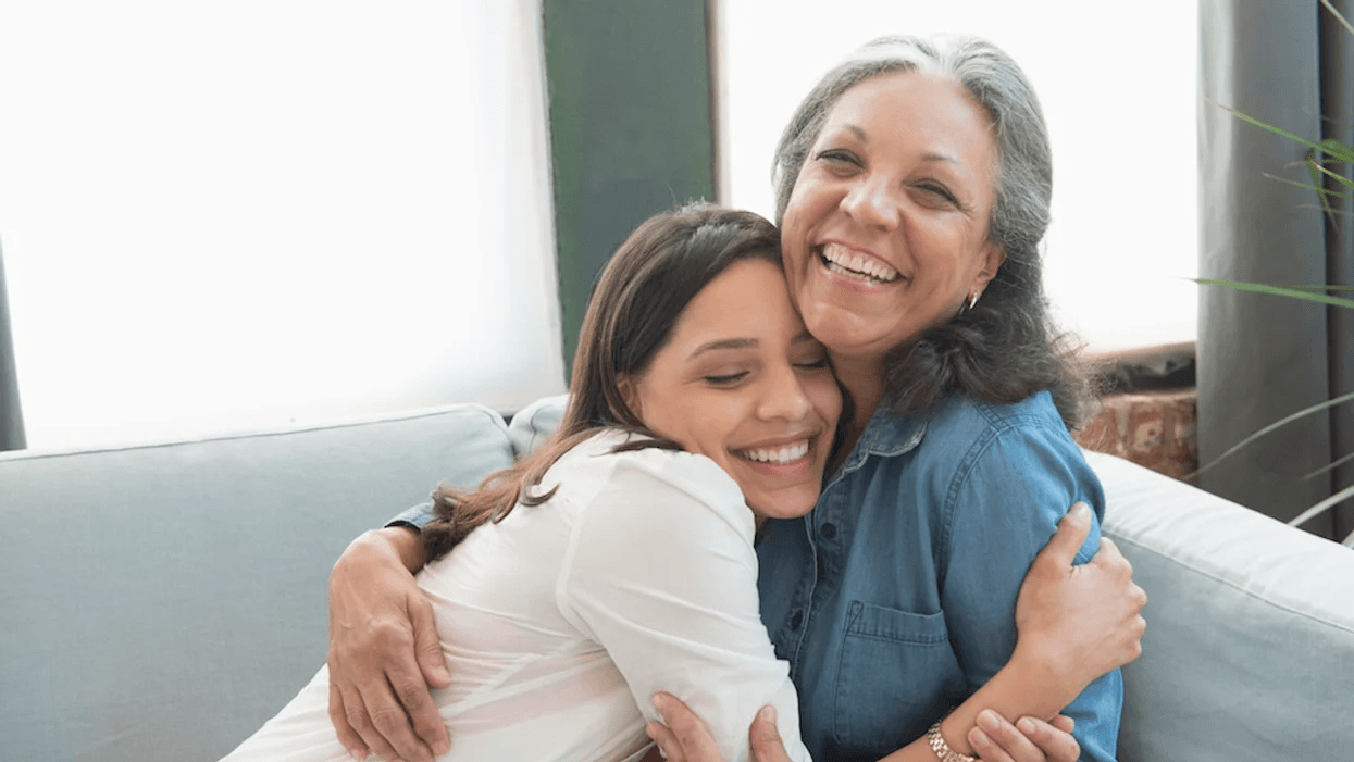 older mom hugging daughter