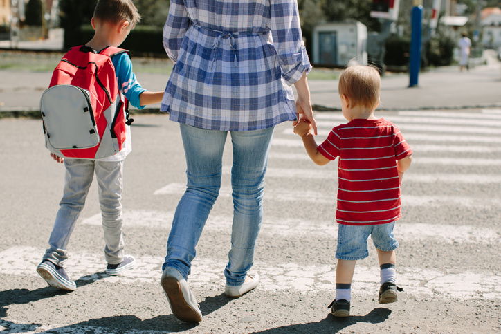 children and parents holding hands