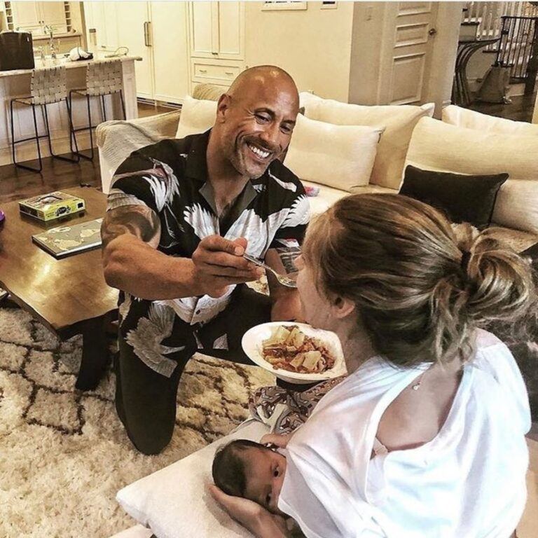 Dwayne Johnson feeding his partner Lauren Hashian while she breastfeeds their child