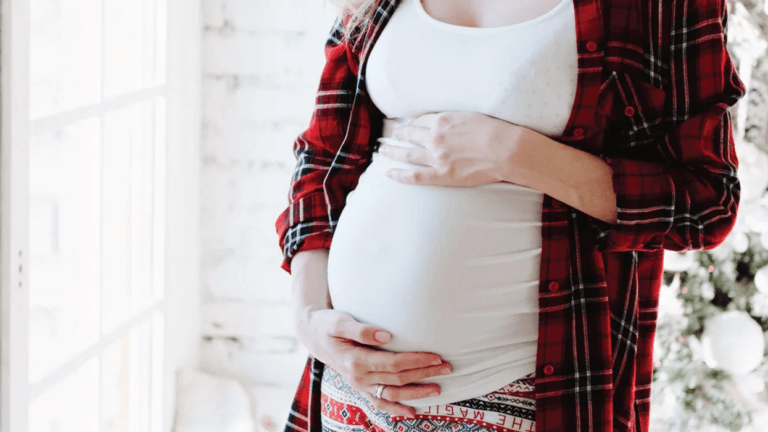 pregnant woman holding belly