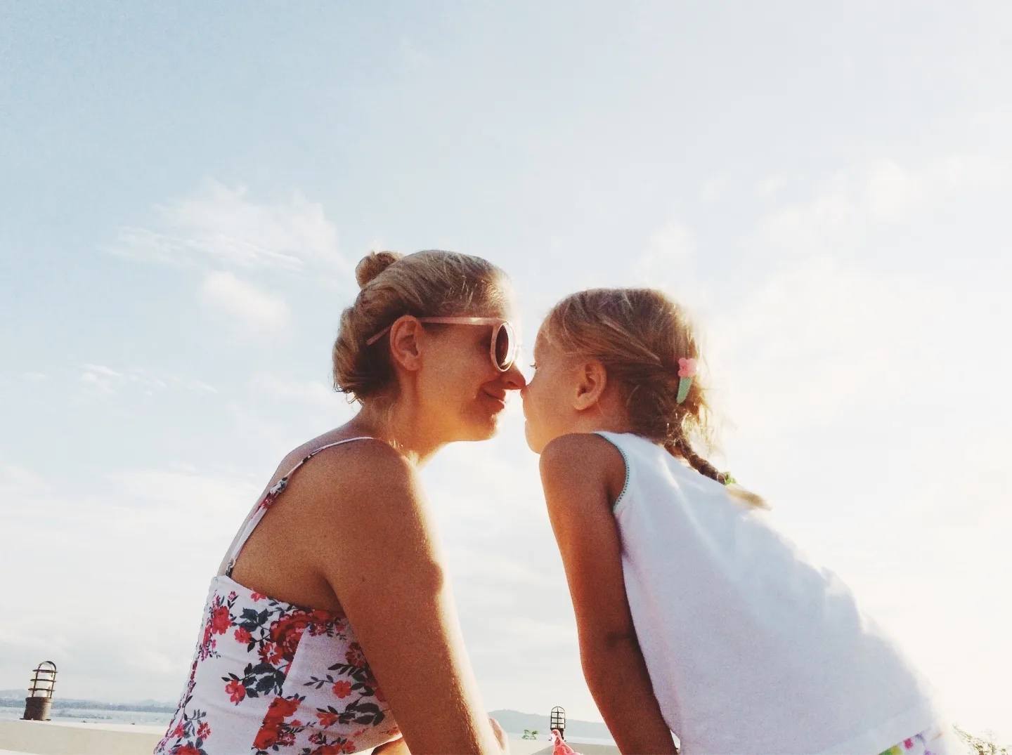 mom and daughter touching noses