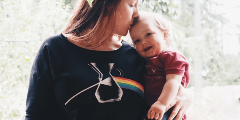 mom kissing baby on the head