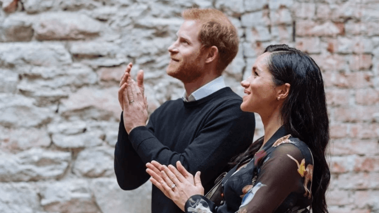 Megan Markle and Prince Harry clapping