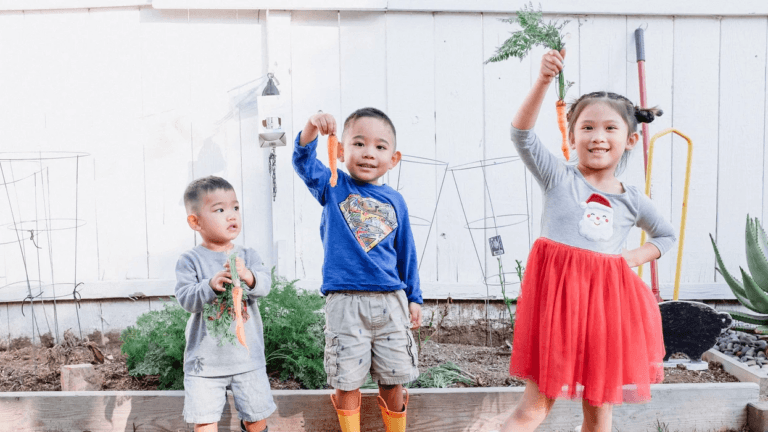 kids playing in a garden- montessori spring activities