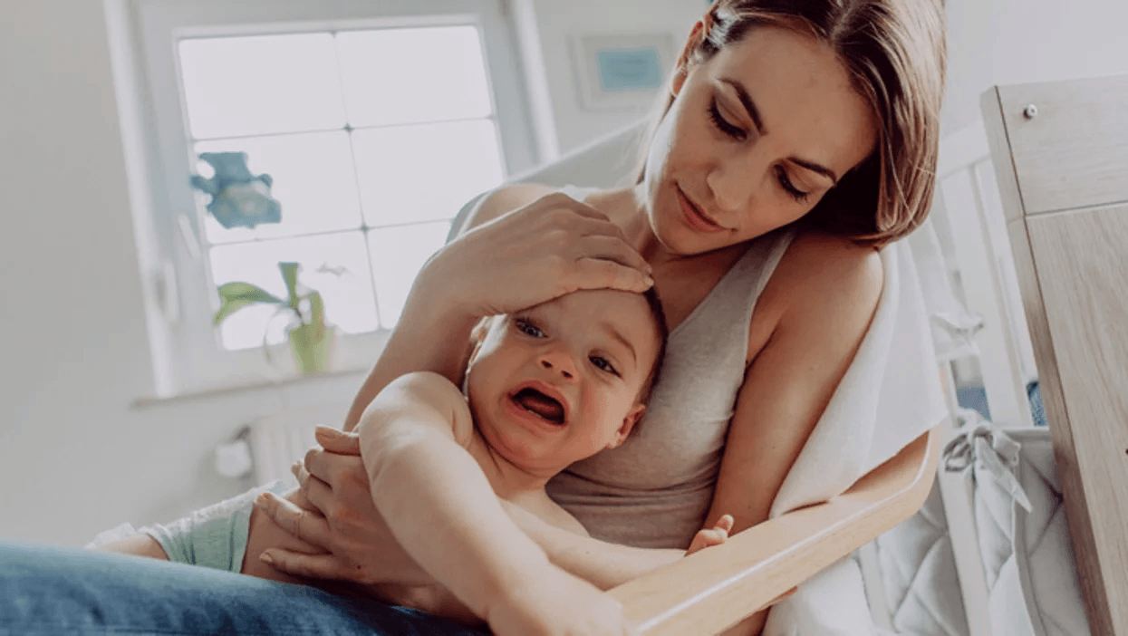 mom comforting upset child