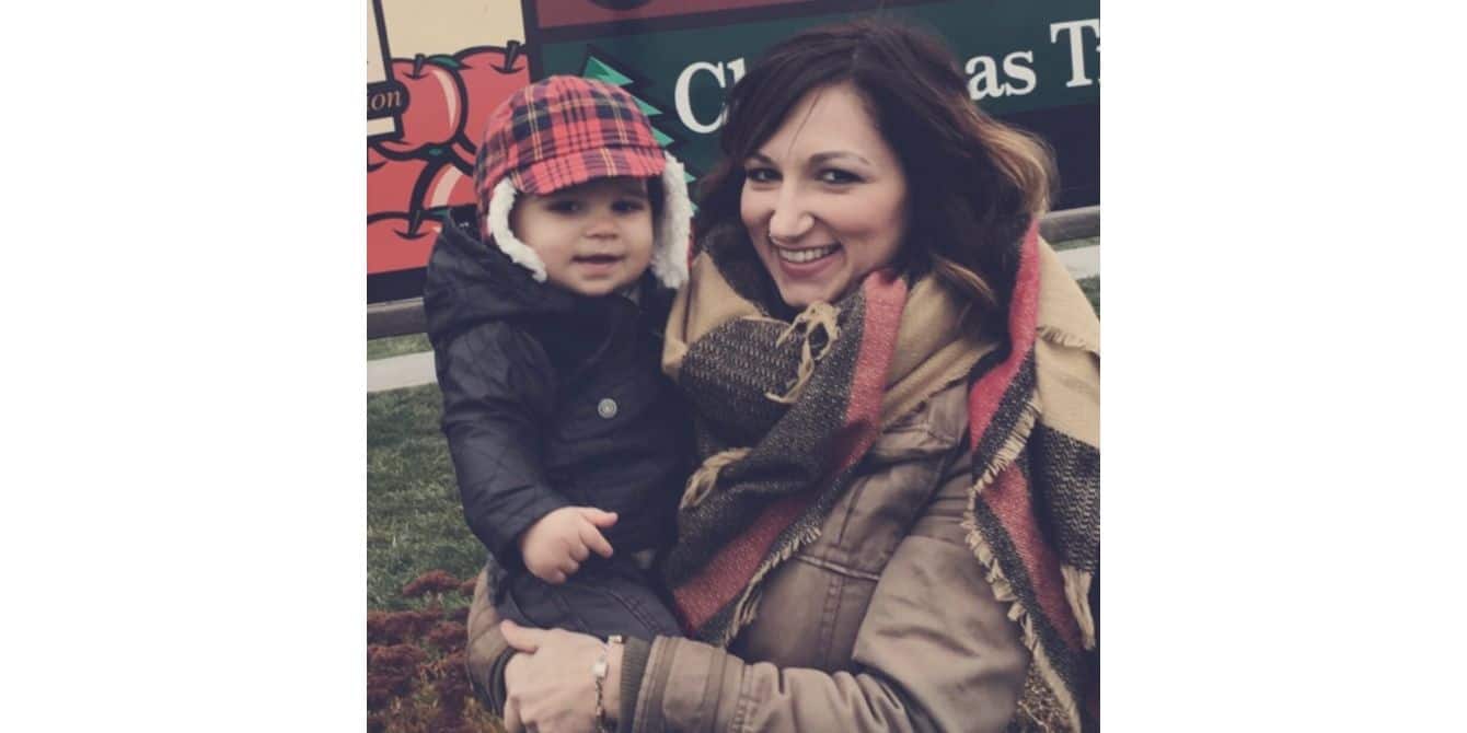 mom holding her toddler at a pumpkin patch - battling postpartum depression