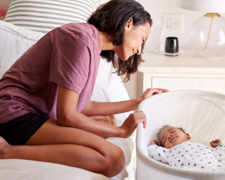 mom watching baby sleep Motherly