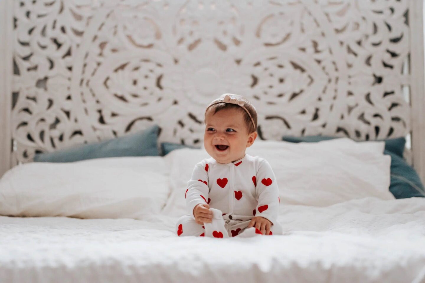cute baby with a Valentine's day onesie- February baby names
