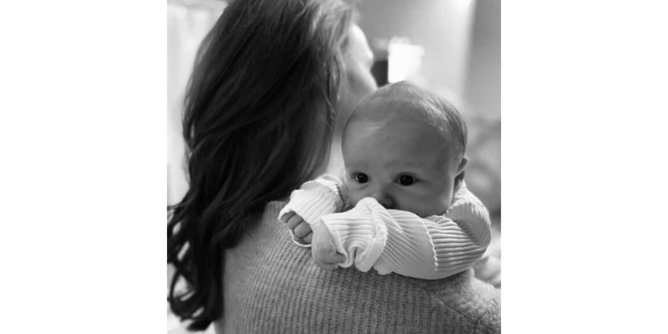 baby in moms arms - essay on postpartum depression during Covid