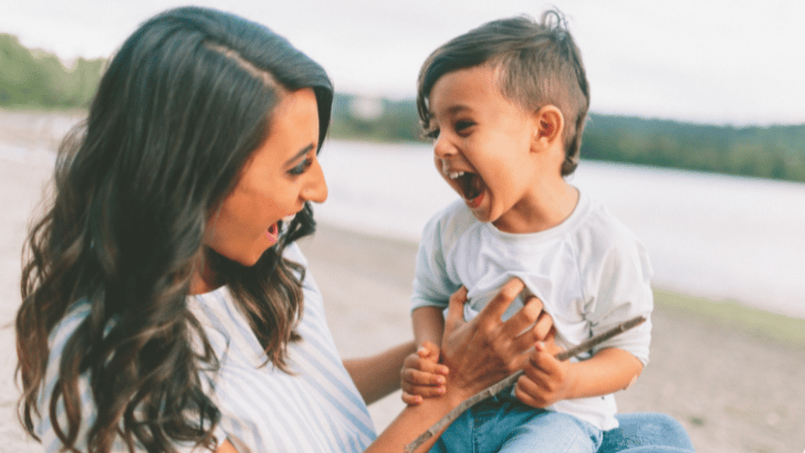 mom laughing with toddler