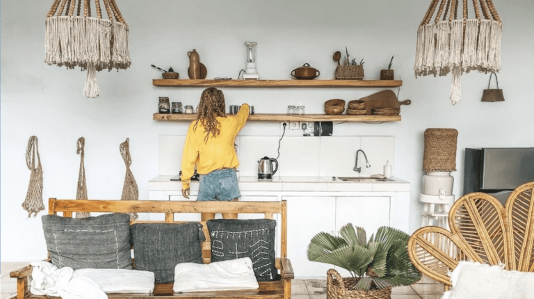 woman styling open shelves