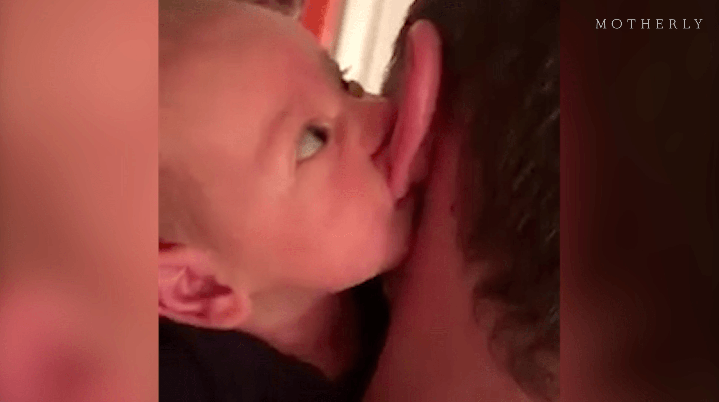 baby latching on to dad's ear