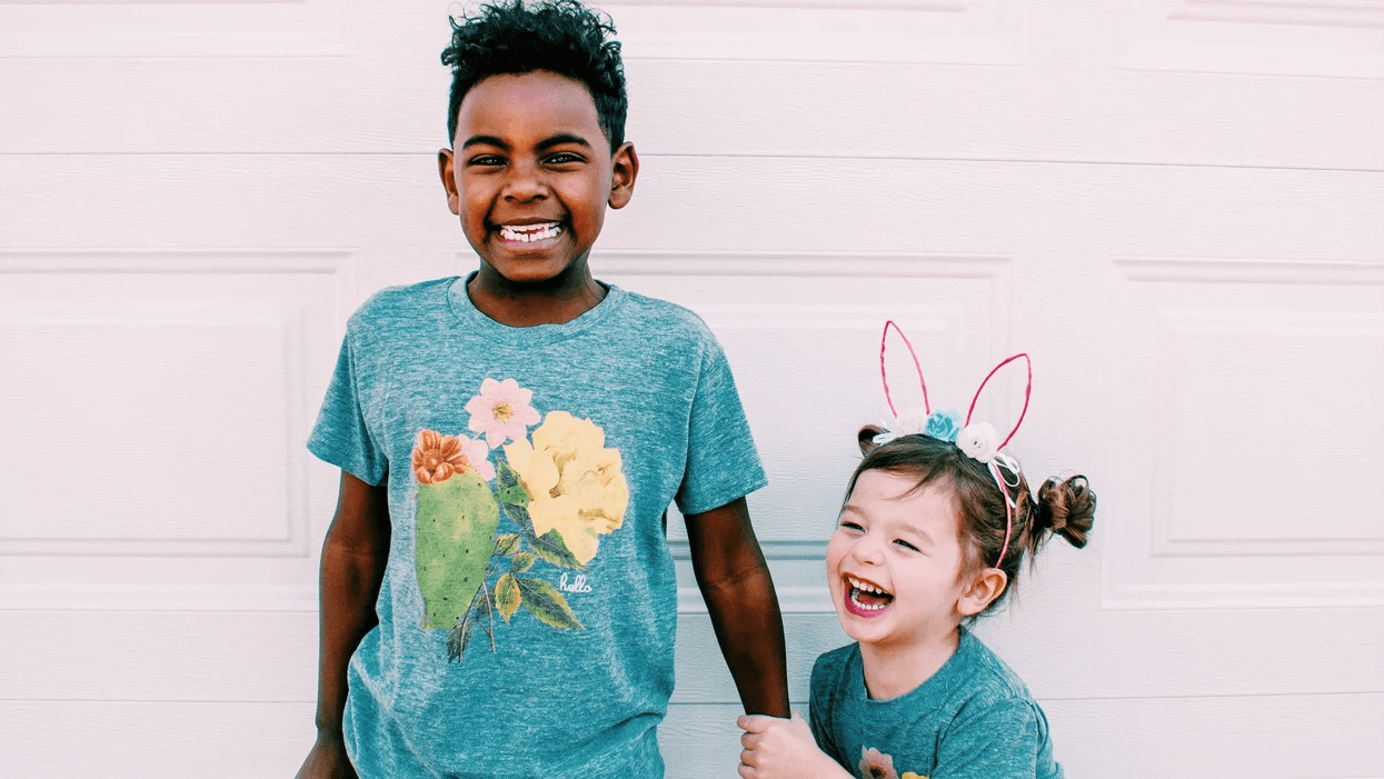 siblings wearing easter shirts and bunny ears- easter activities