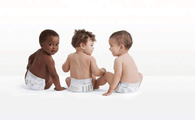 three babies wearing natural diapers in photography studio