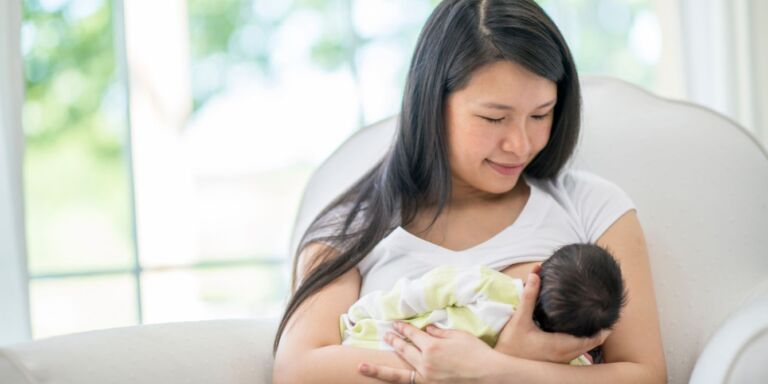 cost of breastfeeding- mom breastfeeding baby