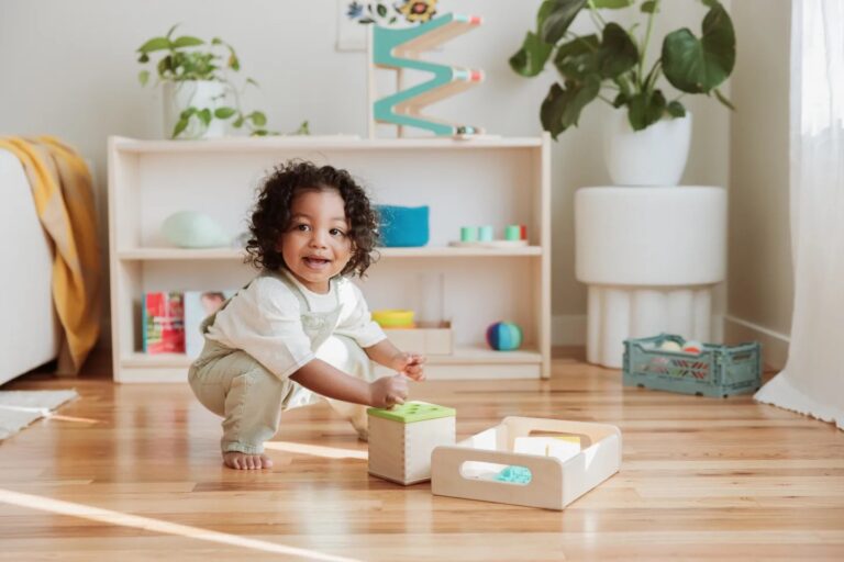 little boy playing with lovevery Montessori toys