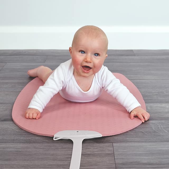 baby on pink yoga mat