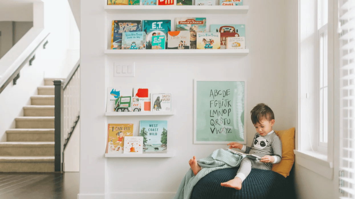 little boy reading a book