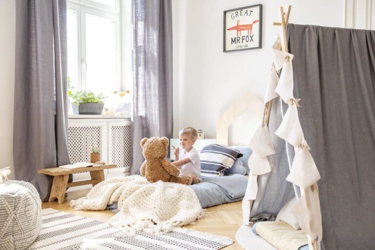 child laying on a montessori floor bed