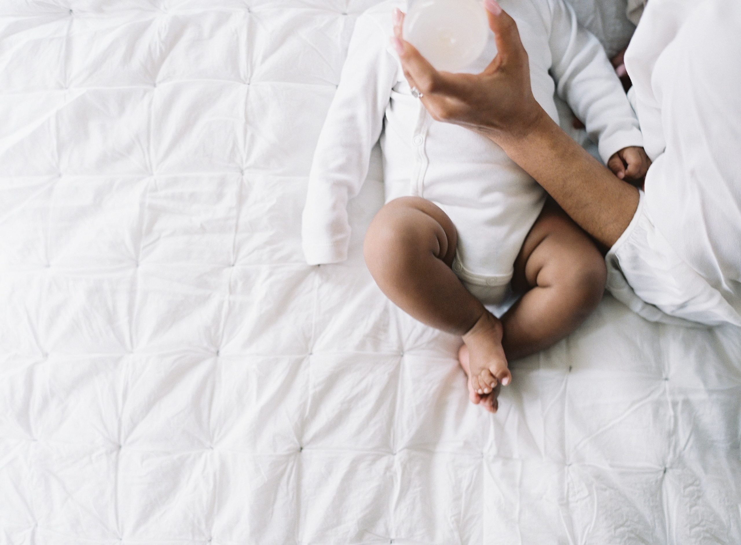 mom giving baby a bottle