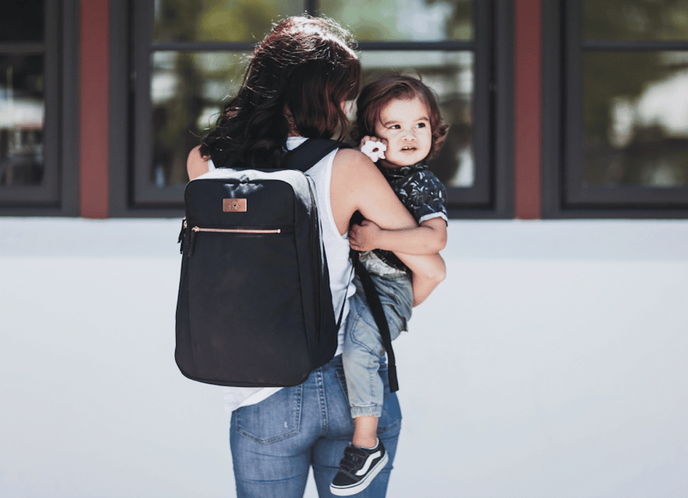 mom carrying toddler