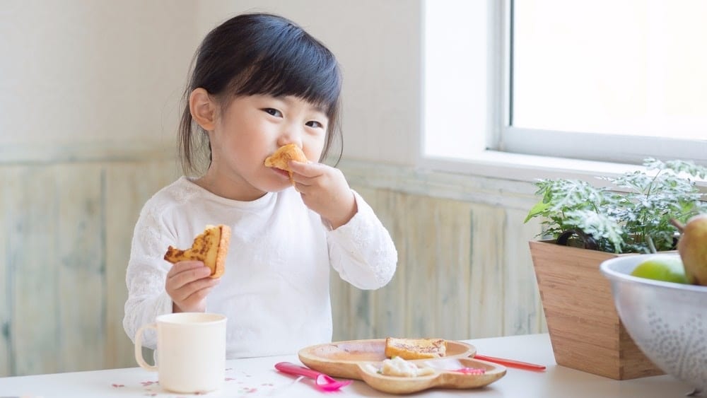 Child eating breakfast