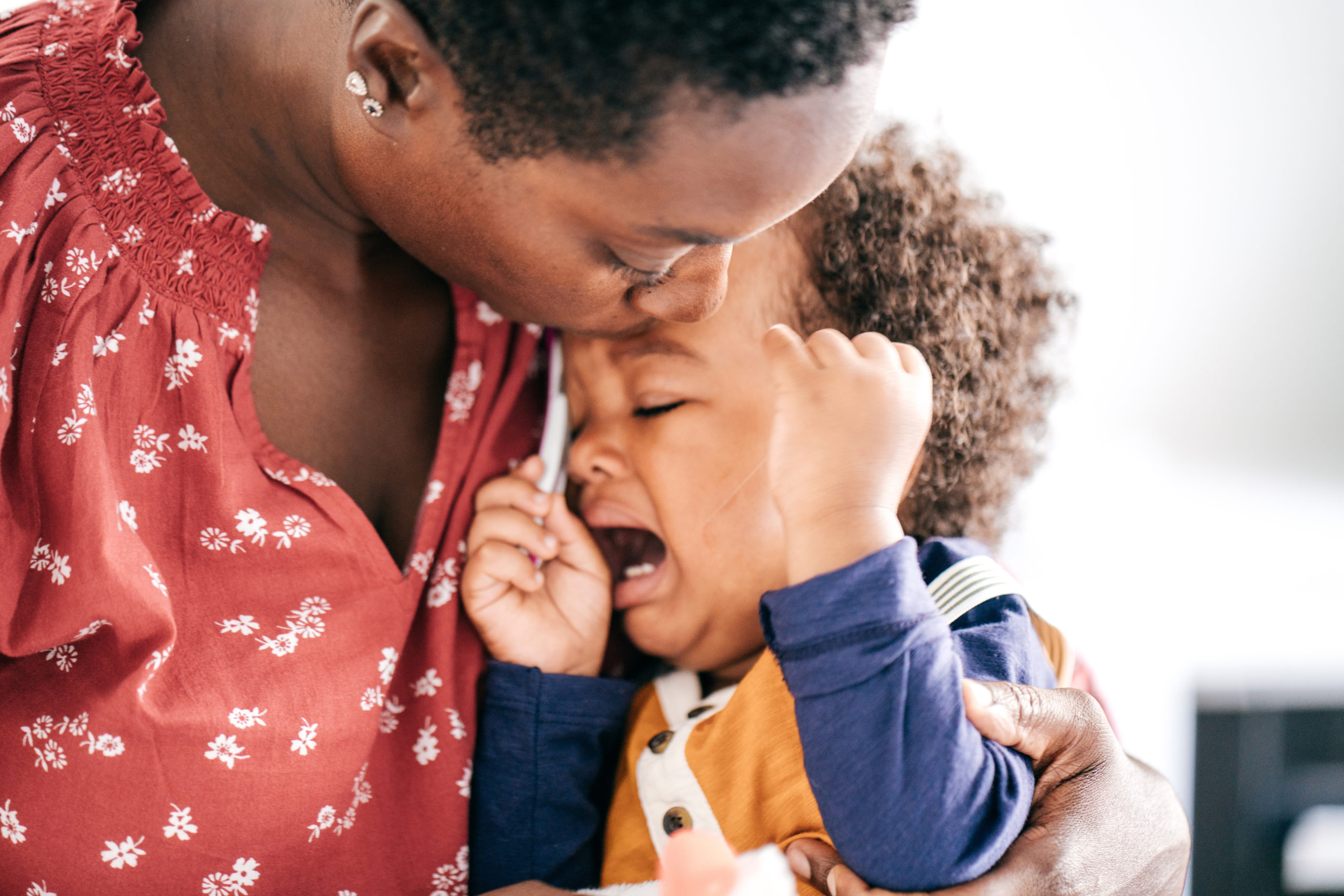 mom consoling a crying child