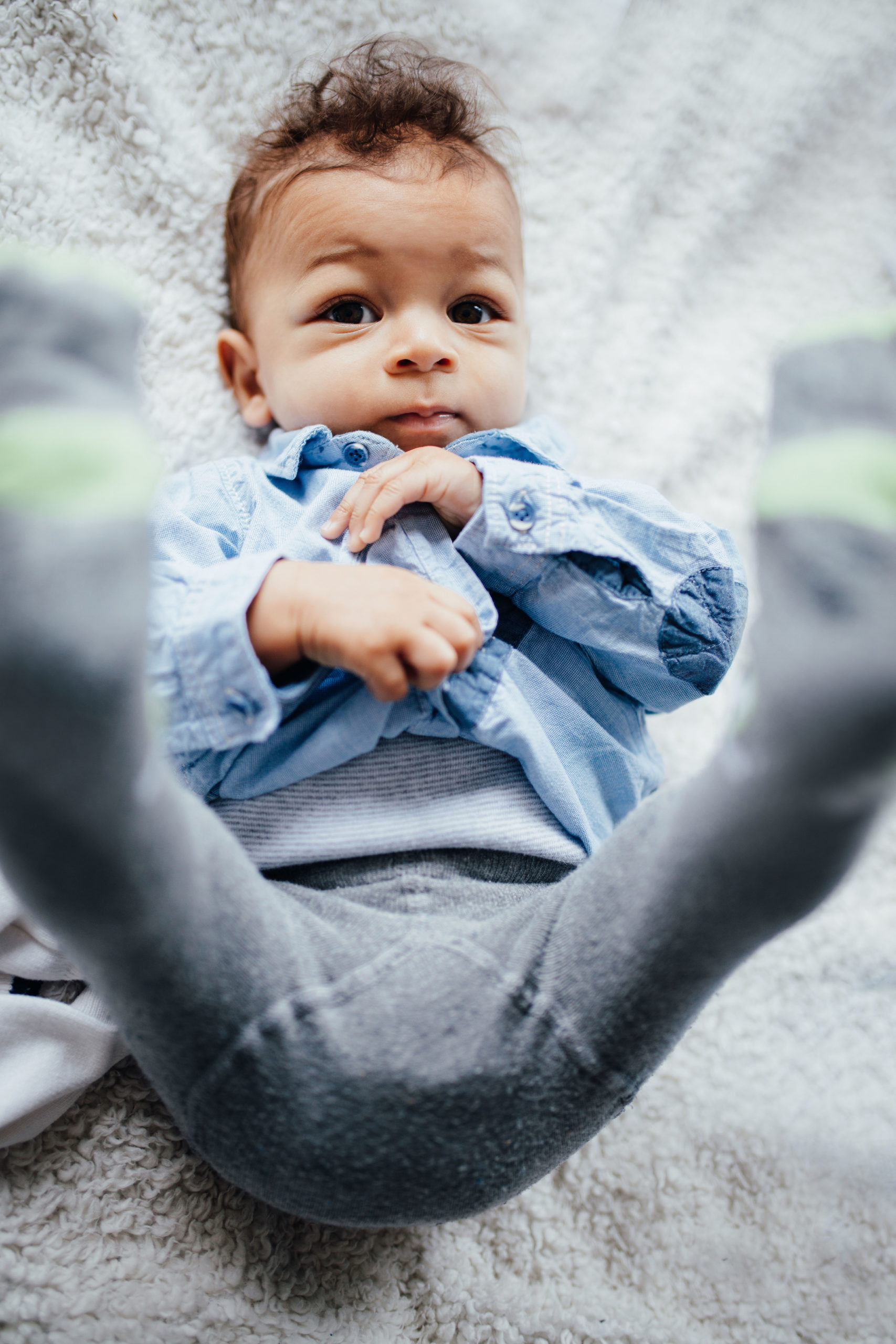 little boy in a button-up shirt