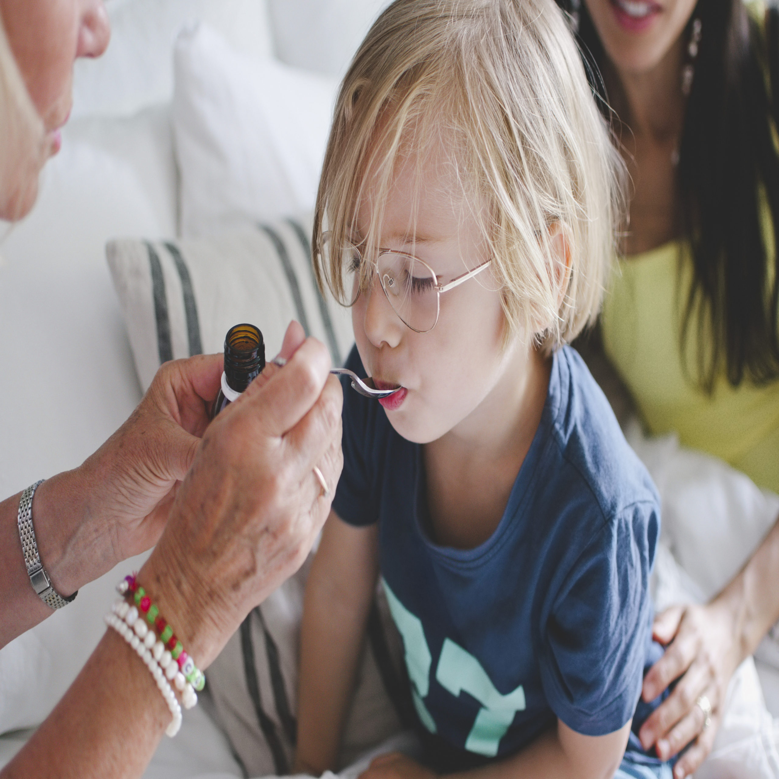 child taking medicine