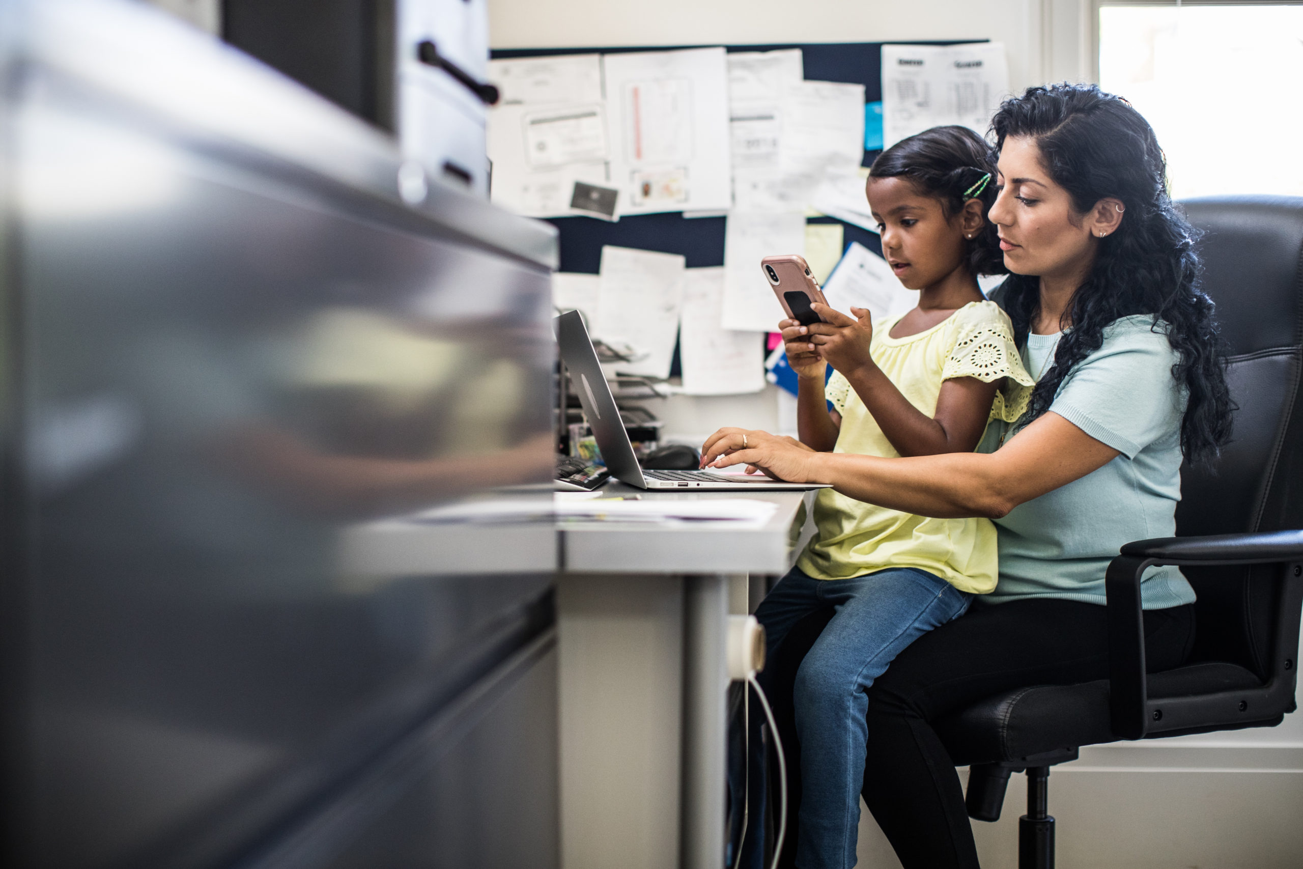 mom working with child on lap