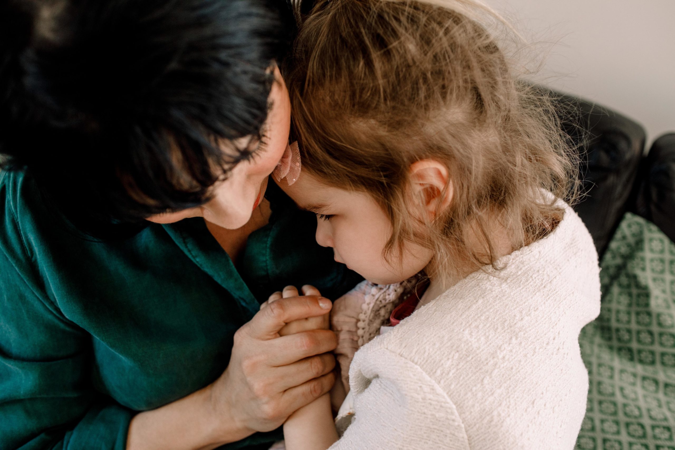 mom comforting her daughter