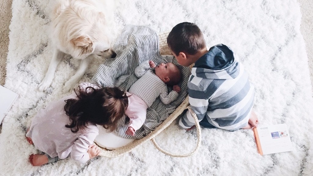 three children playing on the ground