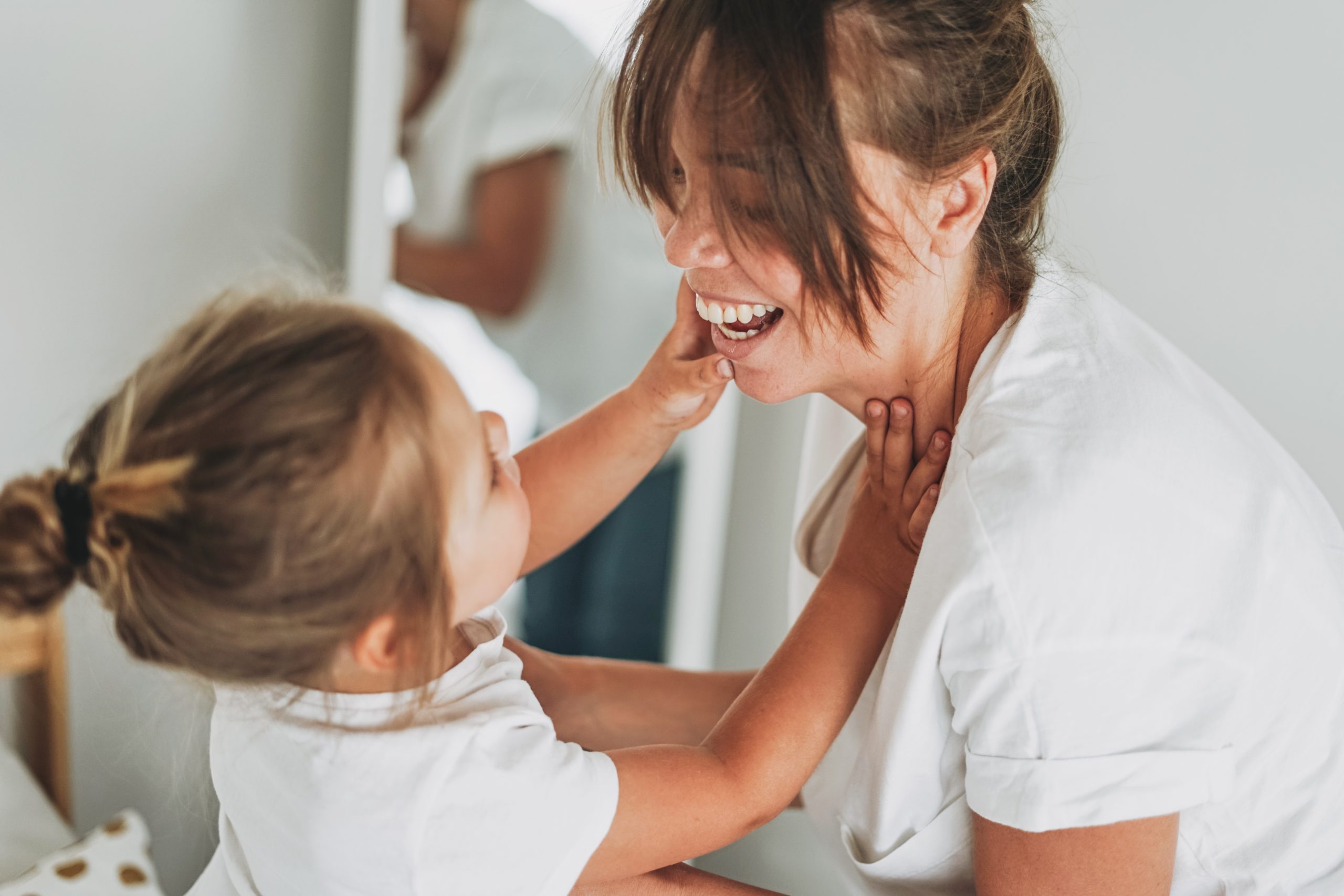 mom and daughter playing