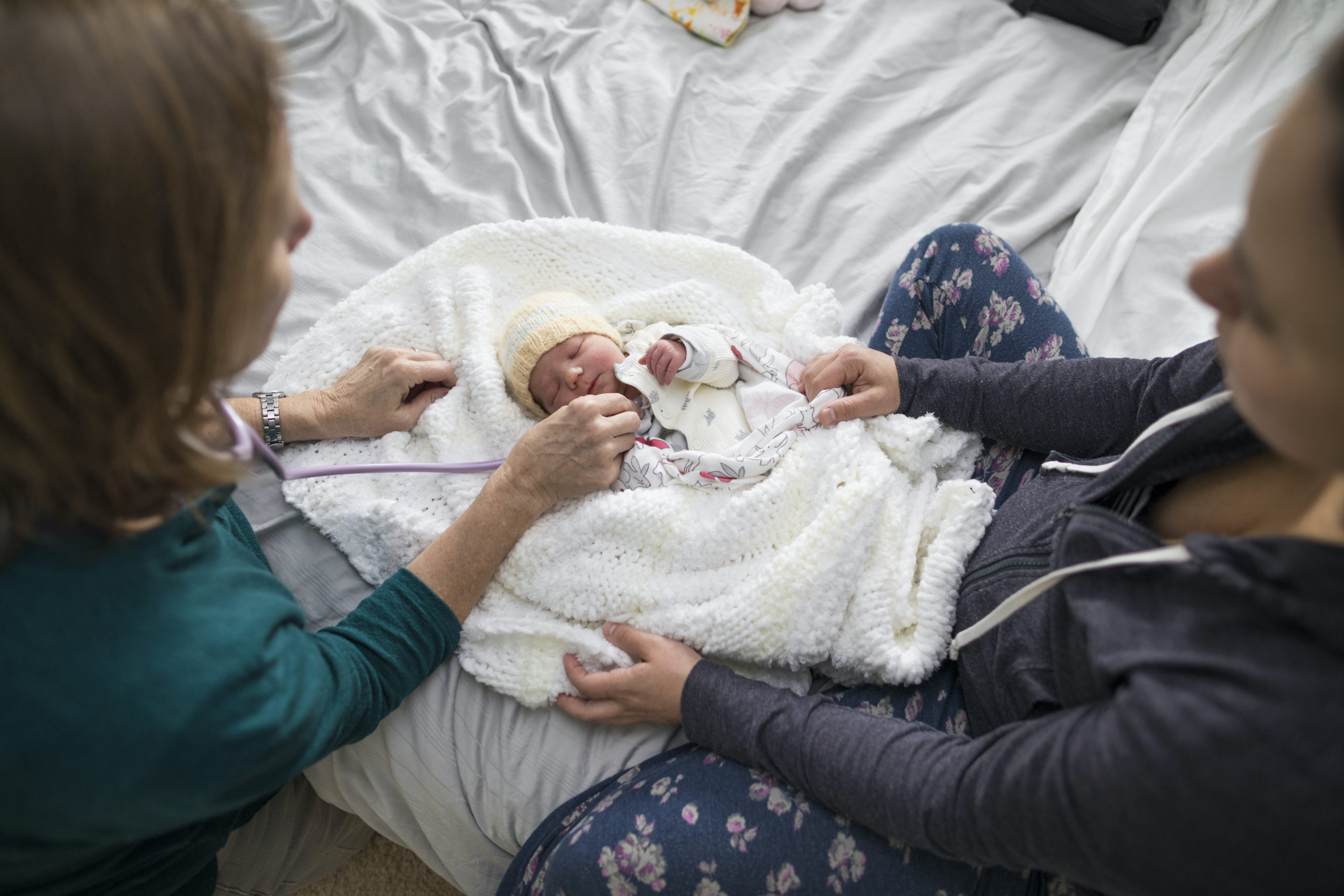 midwife helping mom swaddle baby - to my midwife thank you