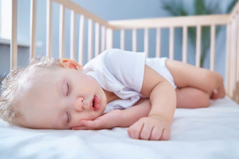 baby sleeping in crib- when do babies drop to one nap