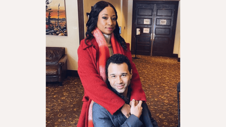 Monique Coleman and Corbin Bleu posing together on the set of their Lifetime movie