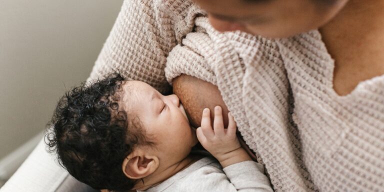 black mother breastfeeding infant son - breastfeeding resources