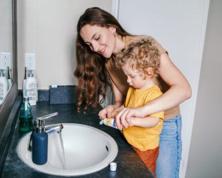 brushing teeth toothbrush wash mother teach help support mom parent parenthood kid bathroom child t20 N0JmrQ