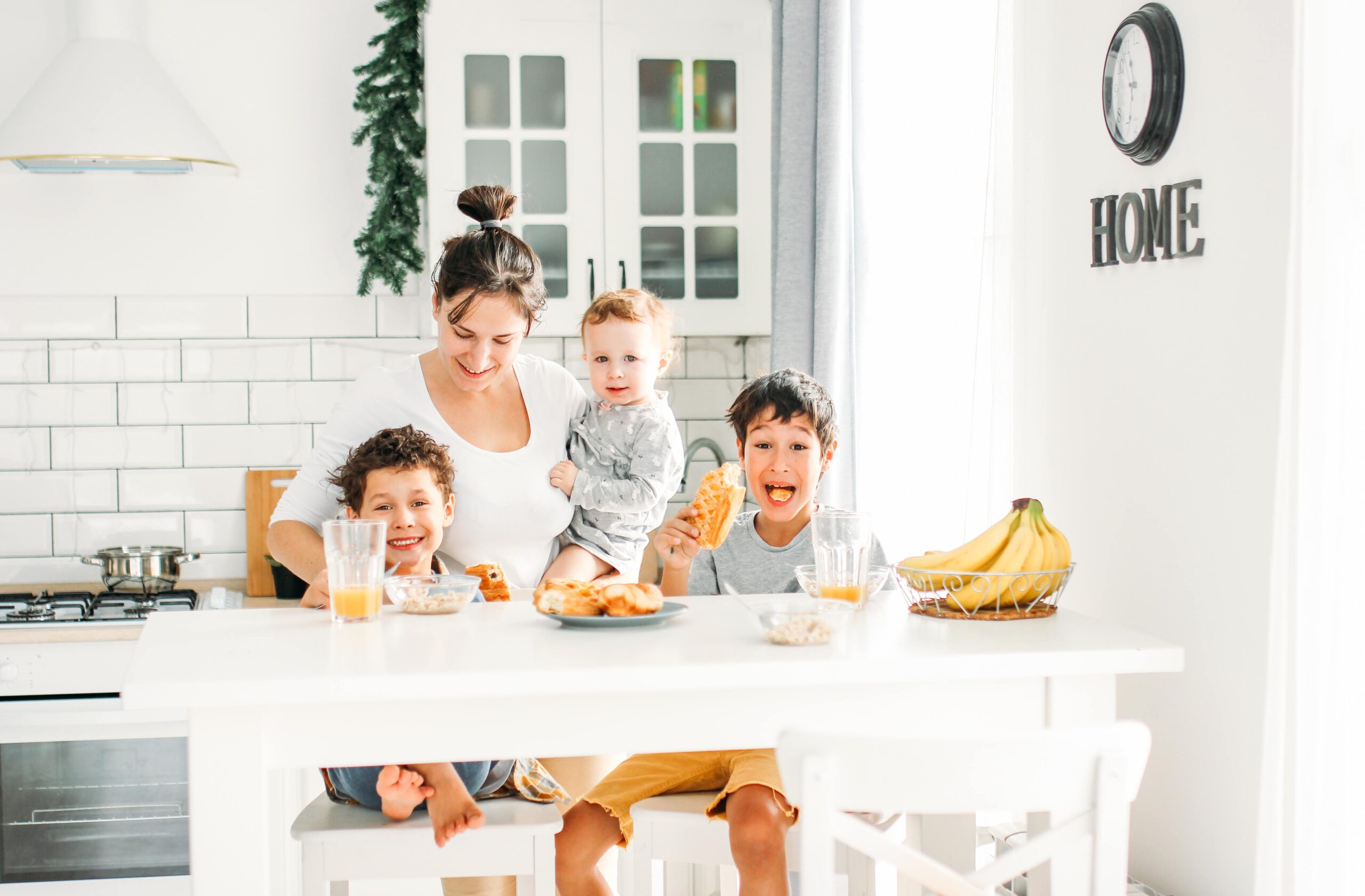 https://www.mother.ly/wp-content/uploads/2022/01/young-woman-mom-with-baby-girl-on-hands-cooking-breakfast-on-bright-kitchen-at-home-large-happy_t20_pRPrX1-scaled.jpg