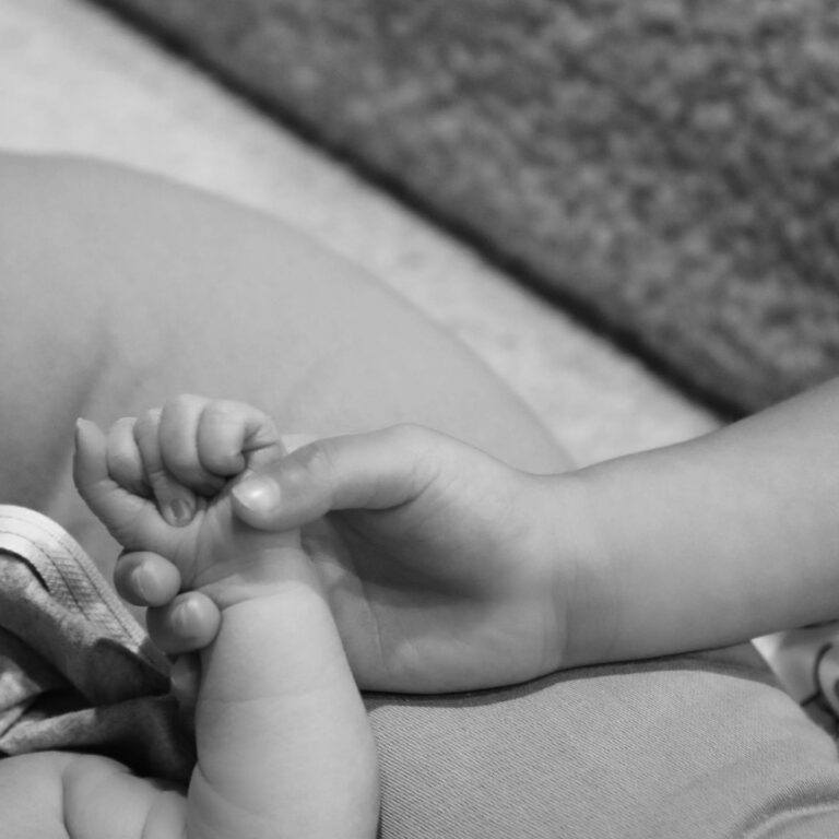 Kylie Jenner's hand with new baby's hand