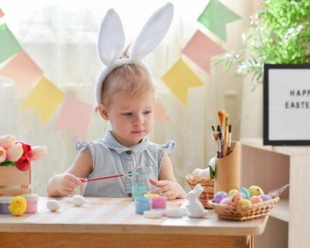 a two year old girl in bunny ears draws easter eggs happy easter do it yourself the child makes t20 7LbE8v Motherly