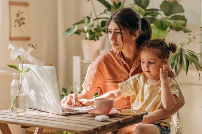 Working mom holding baby career break