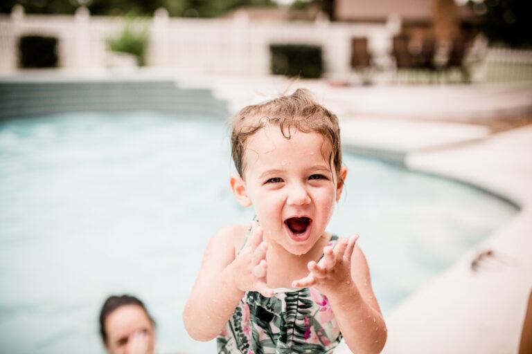 water safety tips: toddler excited at pool