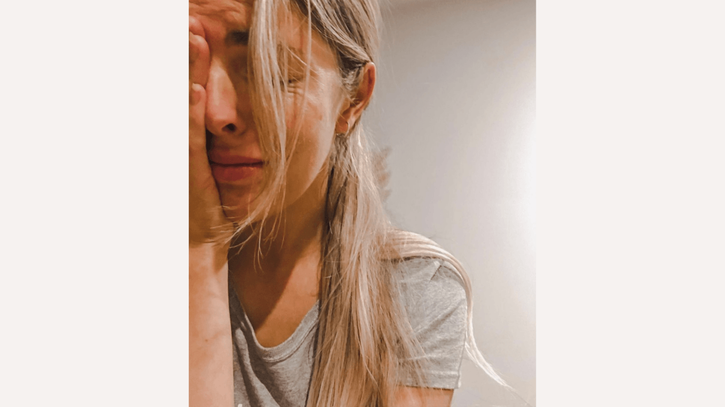 Infertility: woman crying with head in hands