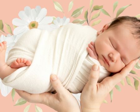 swaddled baby in spring flowers Motherly