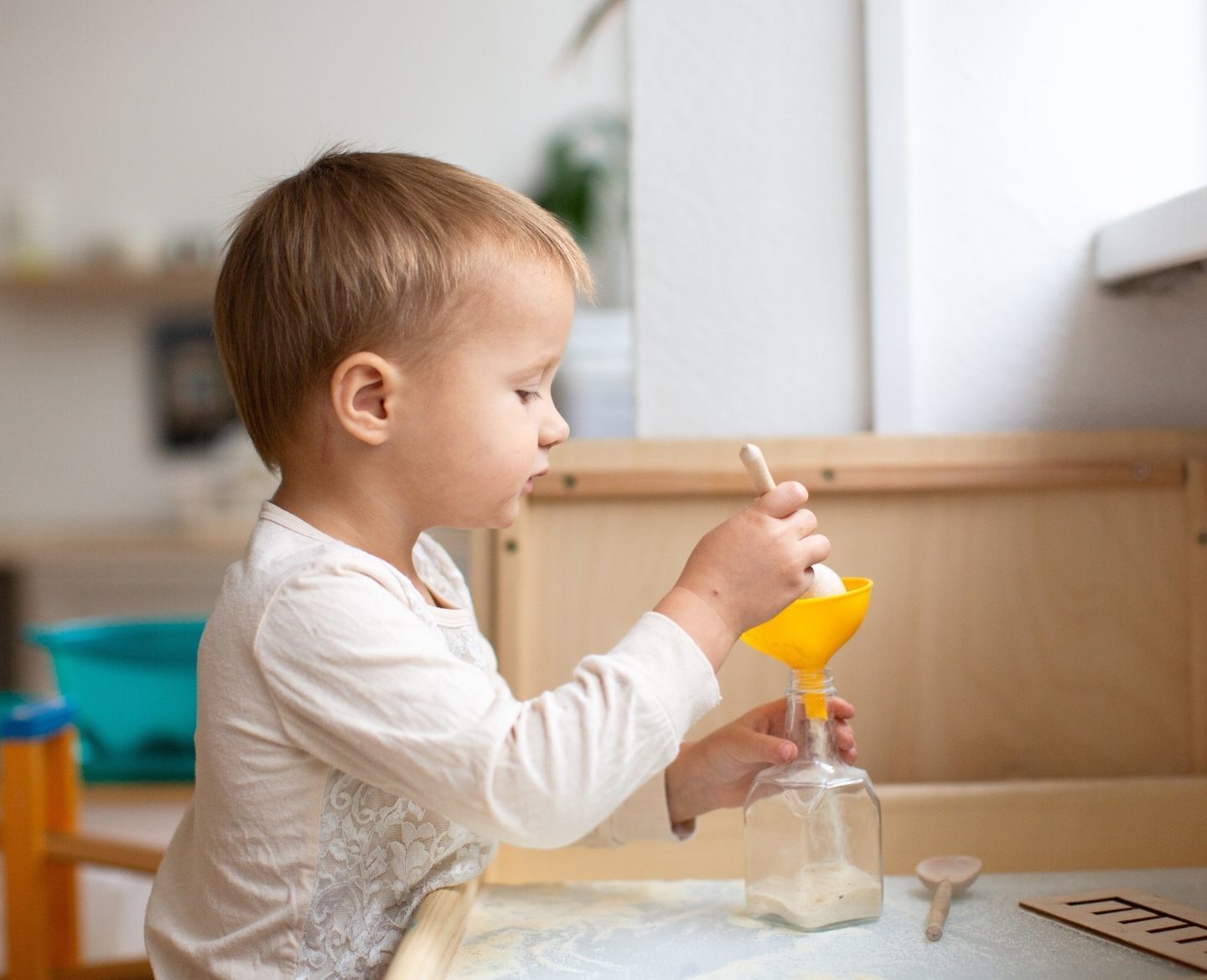 5 Things Kids Learn from Pouring Water - Busy Toddler